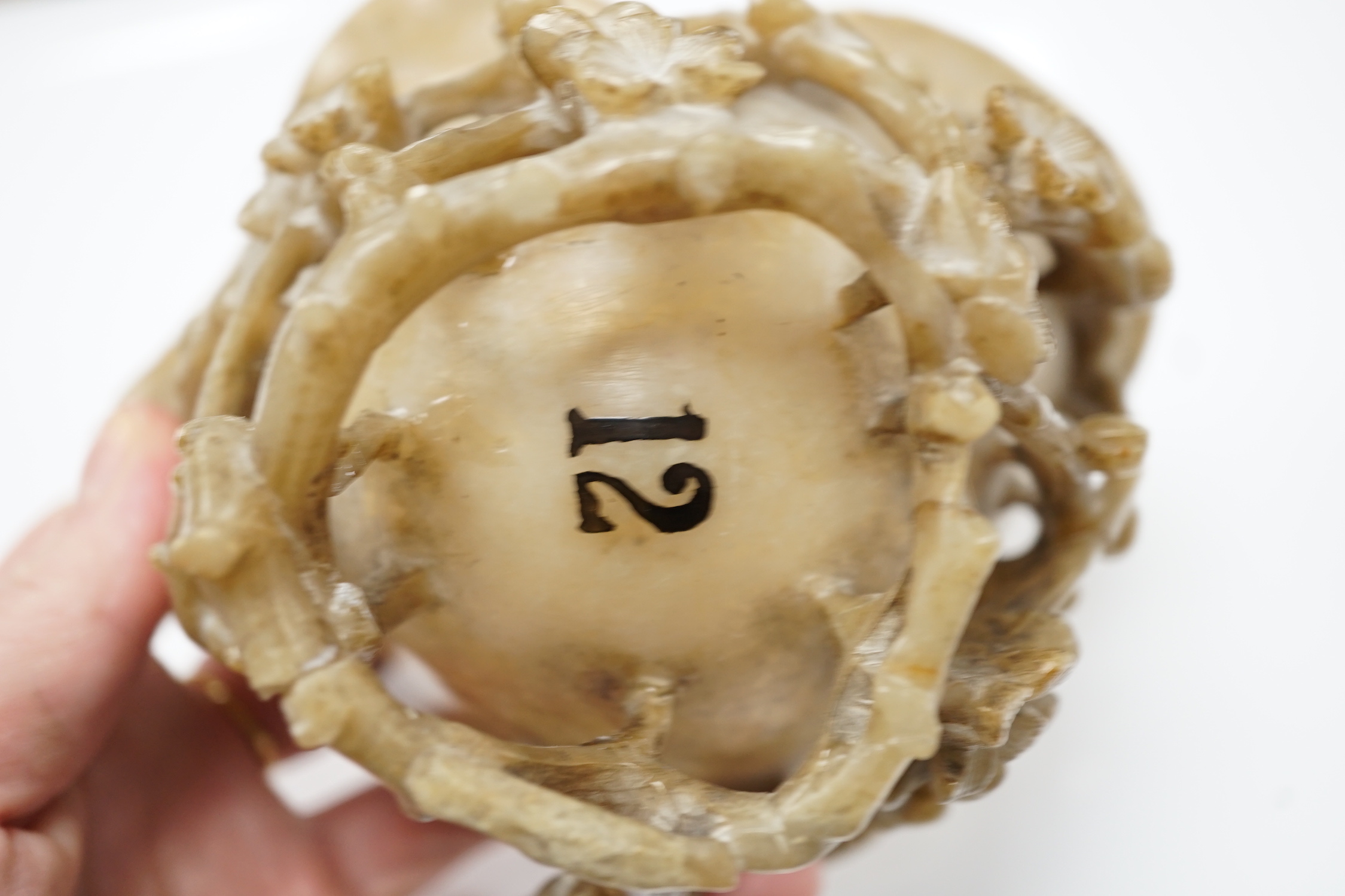 A Chinese carved soapstone libation cup, late 19th century and an elm cased inkstone